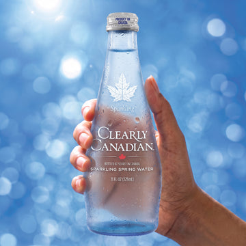 Clearly Sparkling bottle in hand