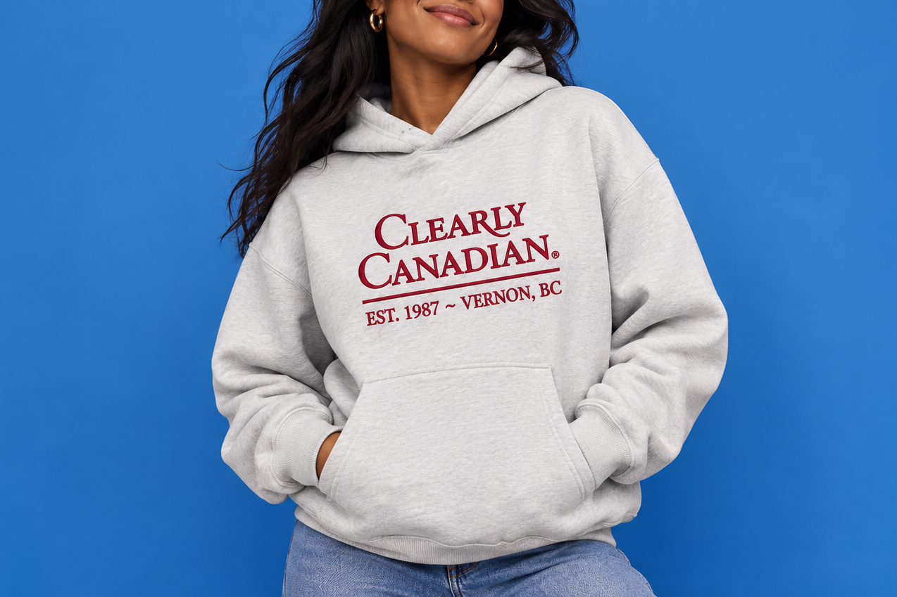 Woman in the grey Clearly Canadian heritage hoodie, Est. 1987 Vernon BC